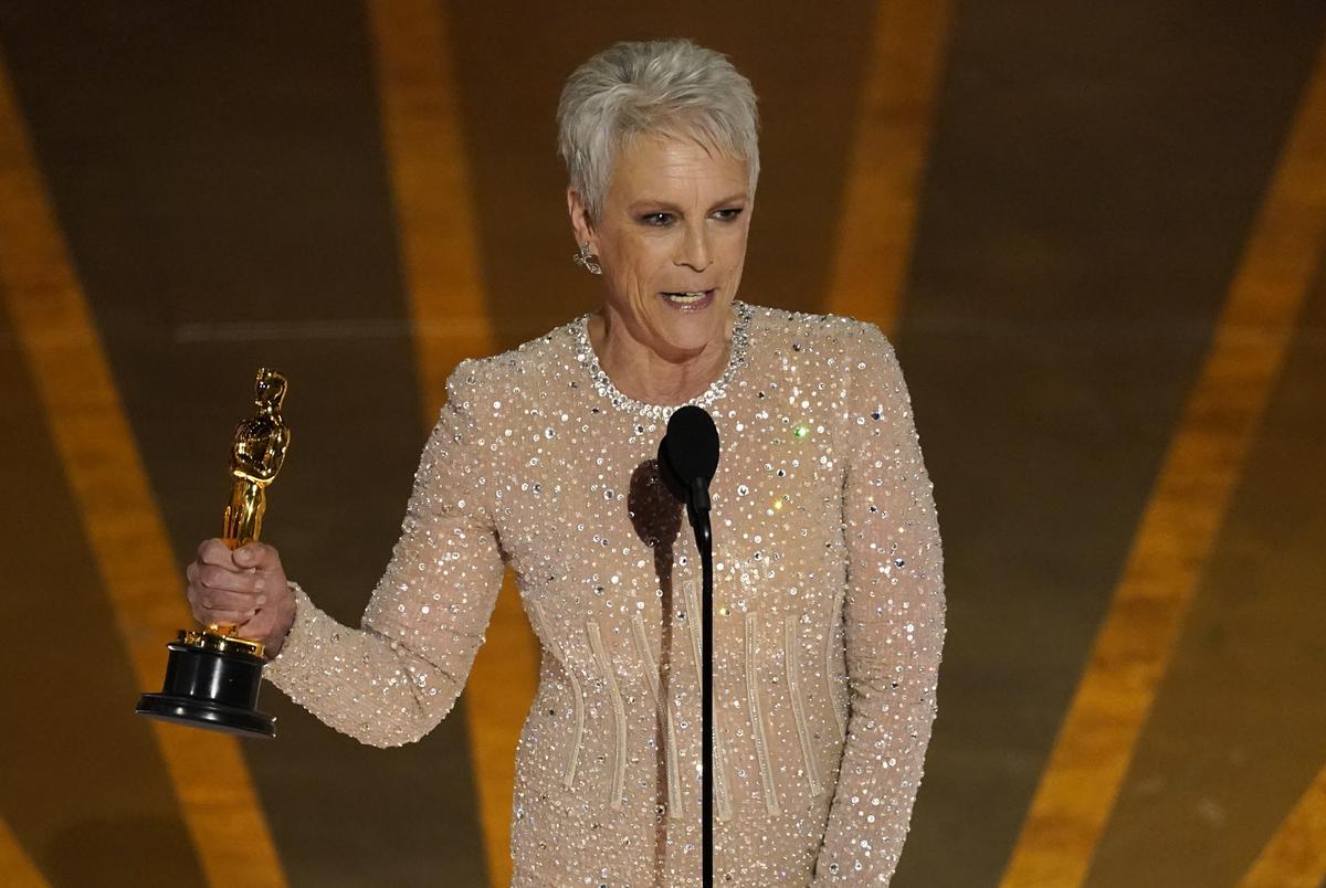 Jamie Lee Curtis accepts the award for best performance by an actress in a supporting role for “Everything Everywhere All at Once” at the Oscars on Sunday, March 12, 2023, at the Dolby Theatre in Los Angeles.