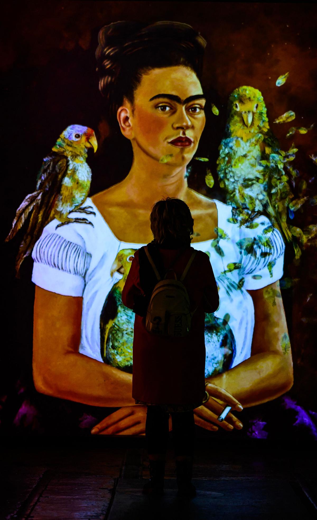 A digital projection of Kahlo’s painting Yo i mis Pericos (Me and My Parrots) in Berlin A digital projection of Kahlo’s painting Yo i mis Pericos (Me and My Parrots) in Berlin