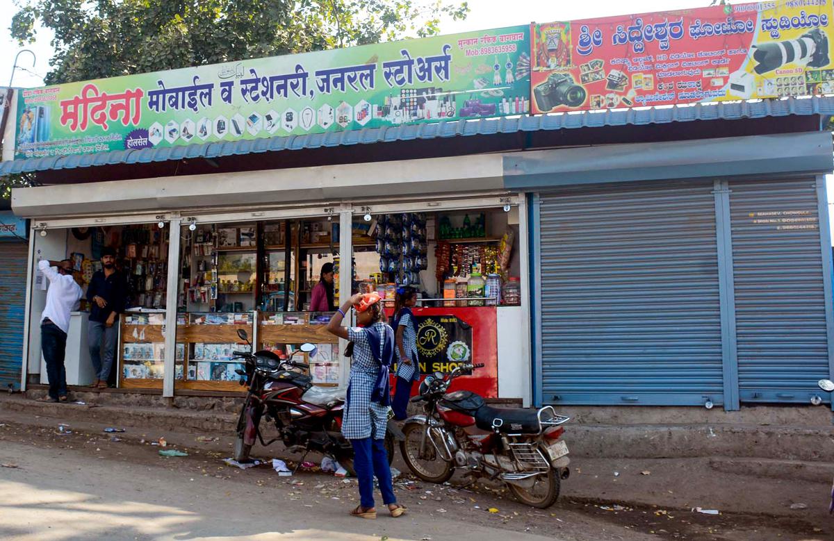 Shops in Gugawad in Maharashtra have sign boards in both Kannada and Marathi.