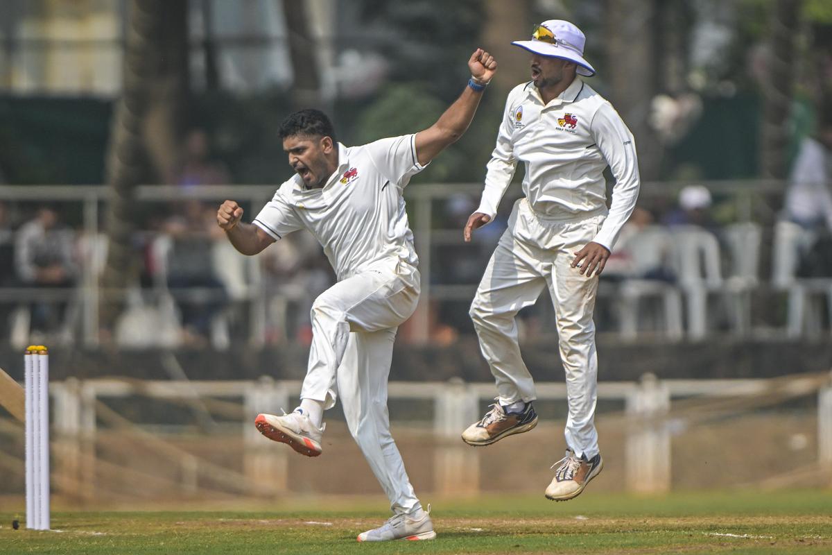 Deshpande, left, is overjoyed after removing Agarwal.