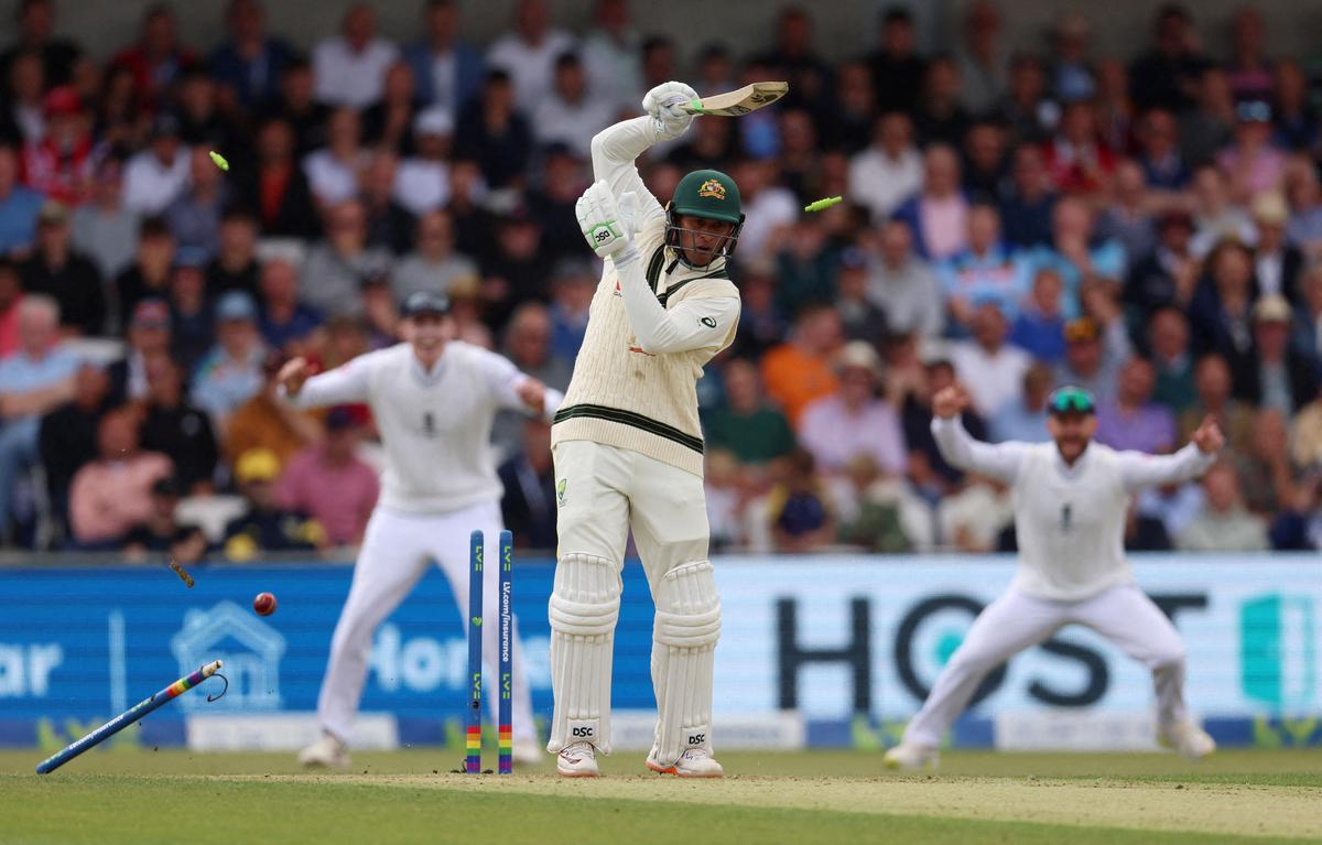 Australia’s Usman Khawaja is bowled out by England’s Mark Wood.    