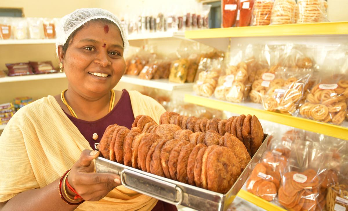 A worker gets adirasam ready for dispatch at Vaibavam Foods, Srirangam.