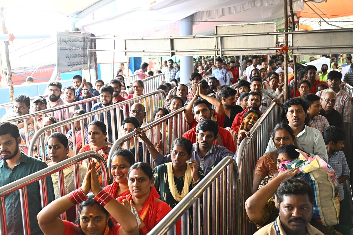Devotees following the queue lines for the darshan of the Goddess at Sri Durga Malleswara Swamyvarla Devasthanam in Vijayawada on Monday.