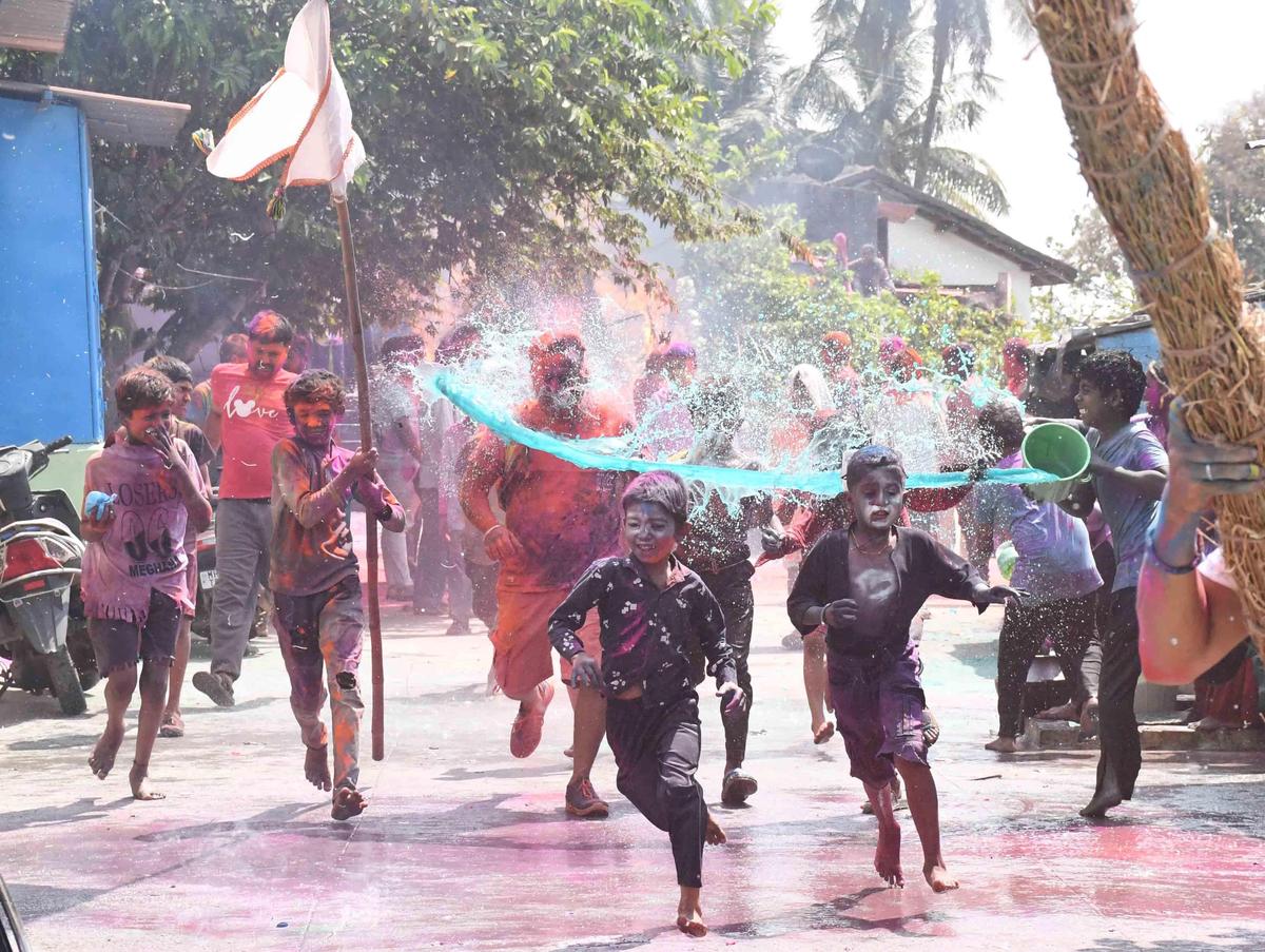 A group of boys in action during the Holi celebrations in Dharwad on Wednesday.