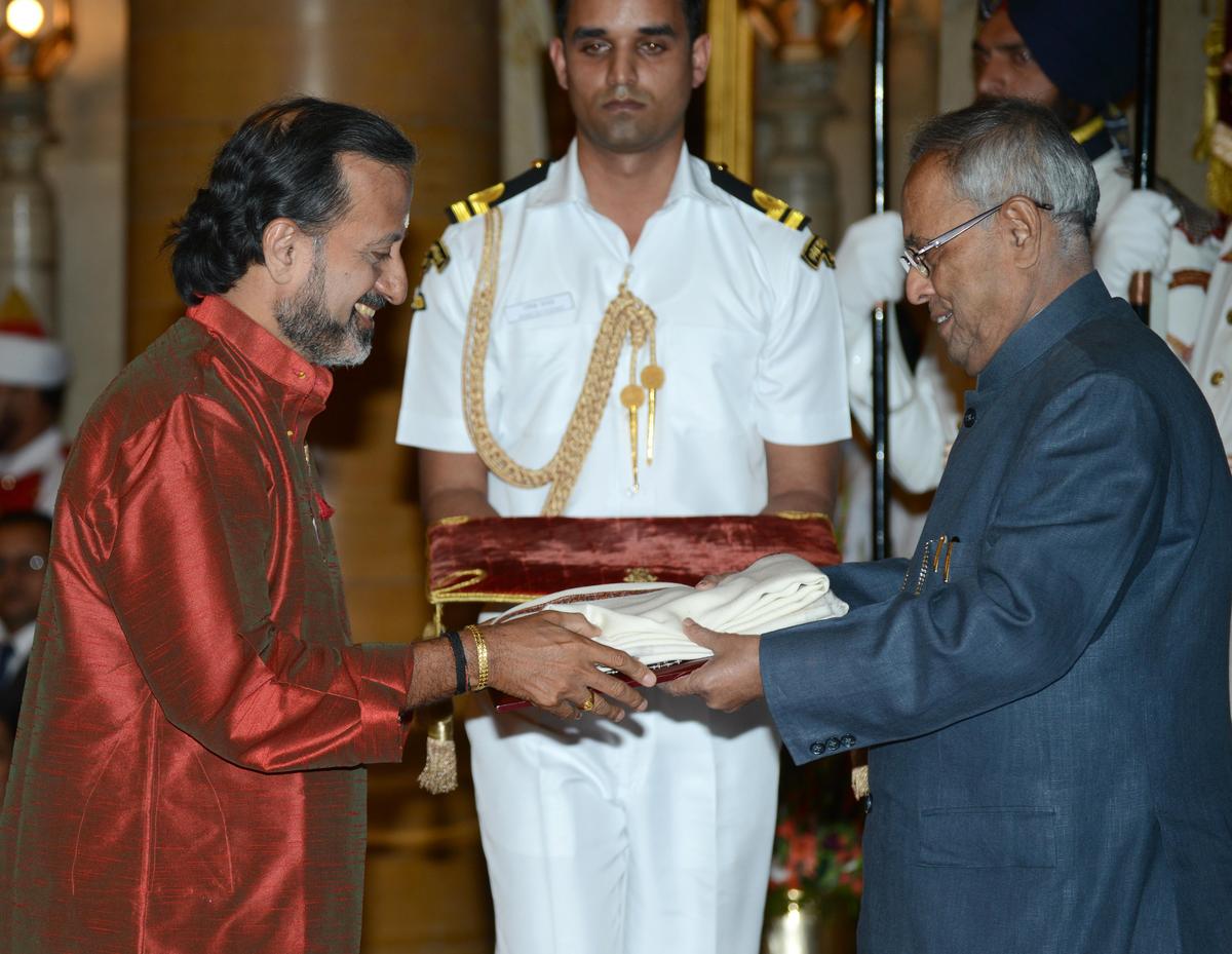 K.V. Prasad receiving the Sangeet Natak Akademi award from former President of India Pranab Mukherjee in 2013. K.V. Prasad receiving the Sangeet Natak Akademi award from former President of India Pranab Mukherjee in 2013.