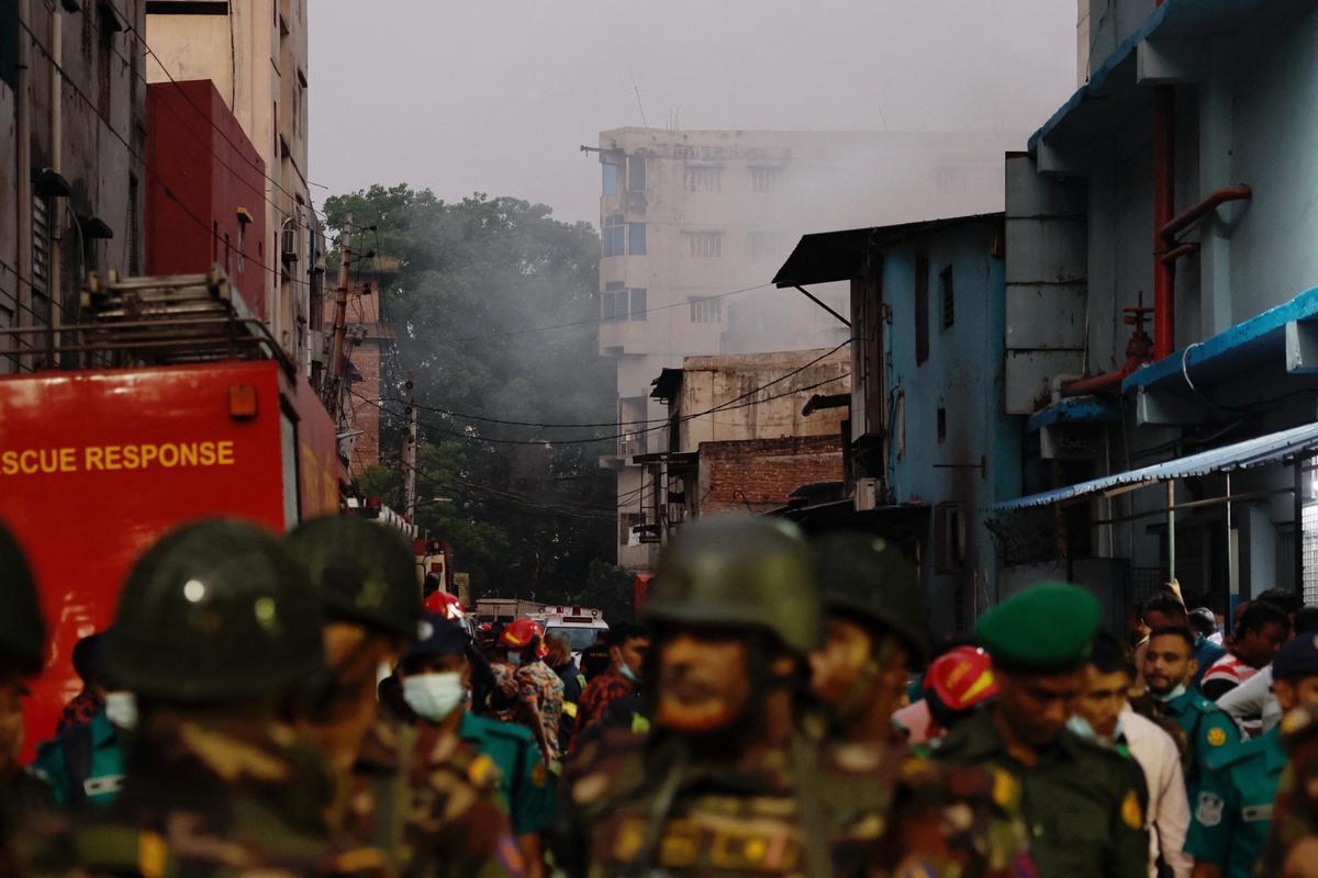Smoke rises from a building as fire broke out at a garment factory and a chemical warehouse in Dhaka, Bangladesh, on October 14, 2025. 
