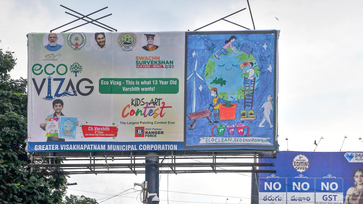 Officials display prizewinning paintings of students at various junctions in Visakhapatnam