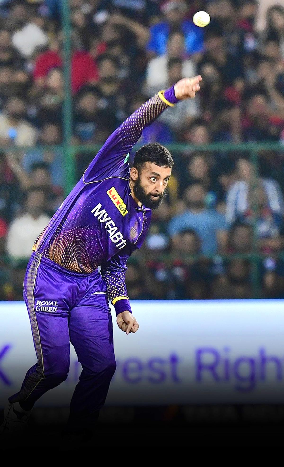 KKR’s Varun Chakravarthy using a higher release point  during the IPL 2023 match against RCB at the M Chinnaswamy Stadium, in Bengaluru on April 26, 2023.  