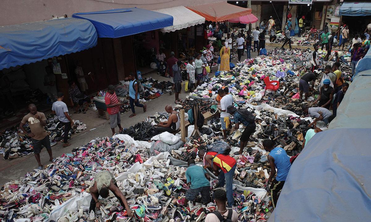 Traders spread out secondhand clothes for sale at the Kantamanto market in Accra, Ghana Traders spread out secondhand clothes for sale at the Kantamanto market in Accra, Ghana