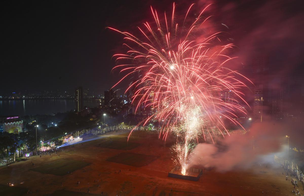 Firecrackers light up the sky during the Diwali celebration, in Mumbai, Sunday, Nov. 12, 2023. 