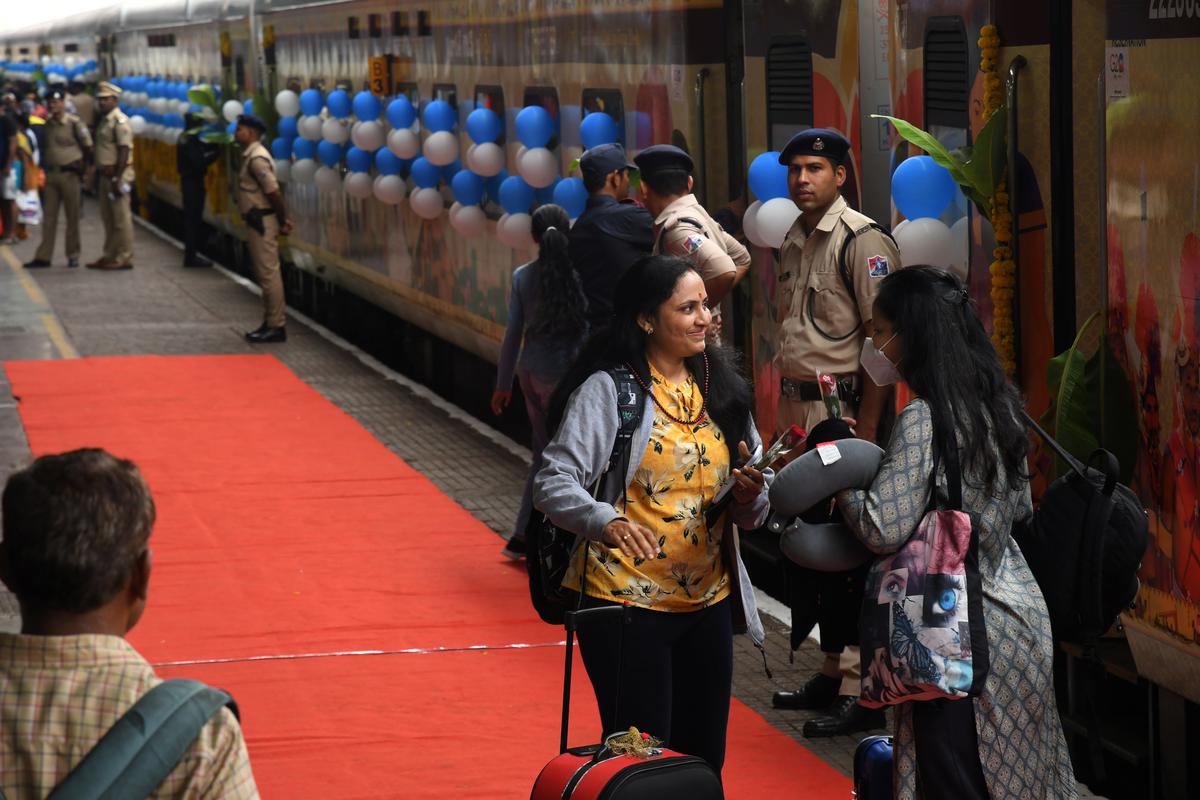 A woman in all smiles set to board the express train.
