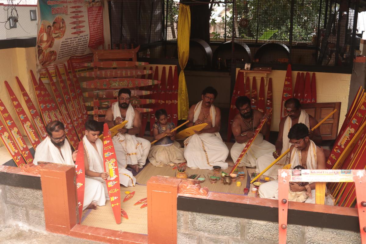 Vilayilveedu family members making the ritualistic Onavillu dedicated to the main deities at Sree Padmanabha Swamy temple in Thiruvananthapuram.