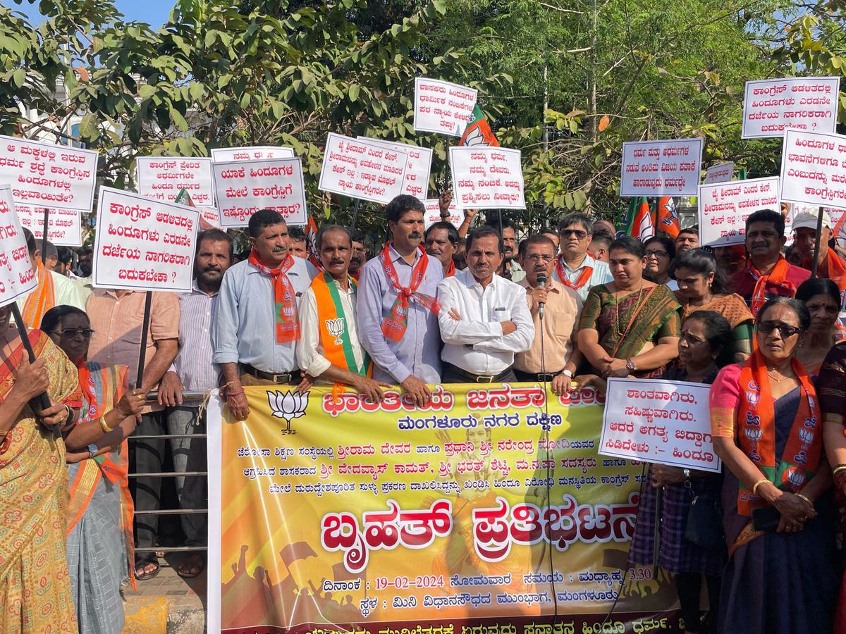 BJP workers staging a protest at Clock Tower Circle in Mangaluru on Monday.