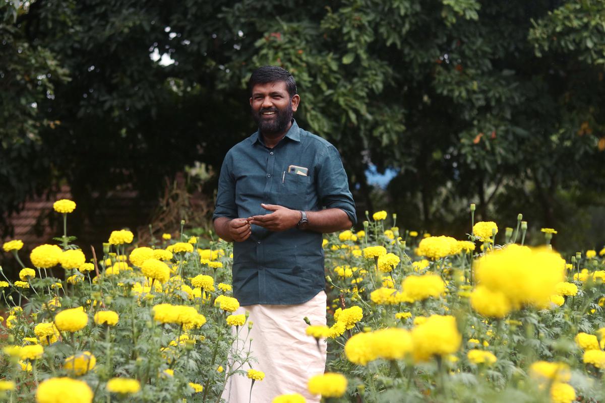 S K Ben Darvin, Parassala block panchayat president, at the marigold farm at Lutheran UP School, Ponvila