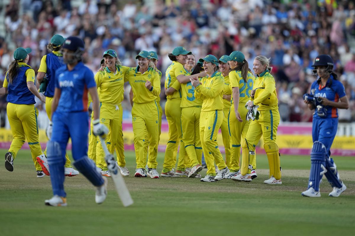 Australian players celebrate their win in the women’s cricket T20 final match against India at Edgbaston at the Commonwealth Games in Birmingham, England