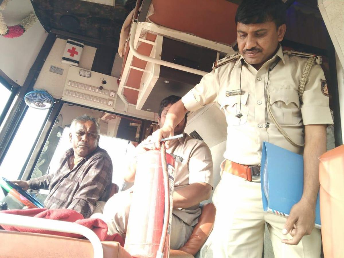 A Transport Department officer inspecting a private bus at Attibele and Devanahalli in Bengaluru, as part of a week-long drive launched in the wake of the recent Kurnool bus fire accident.