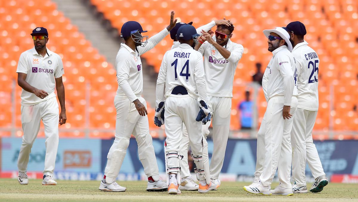 Milestone: Axar Patel is congratulated on dismissing Travis Head for his 50th Test wicket.