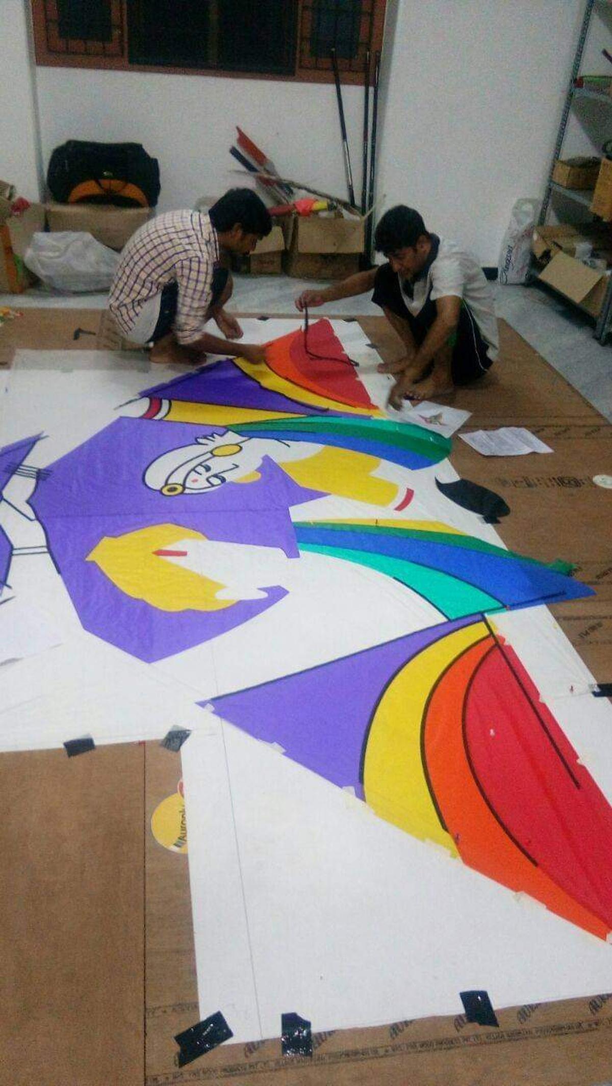 Kite makers making a kite in Mangaluru. 