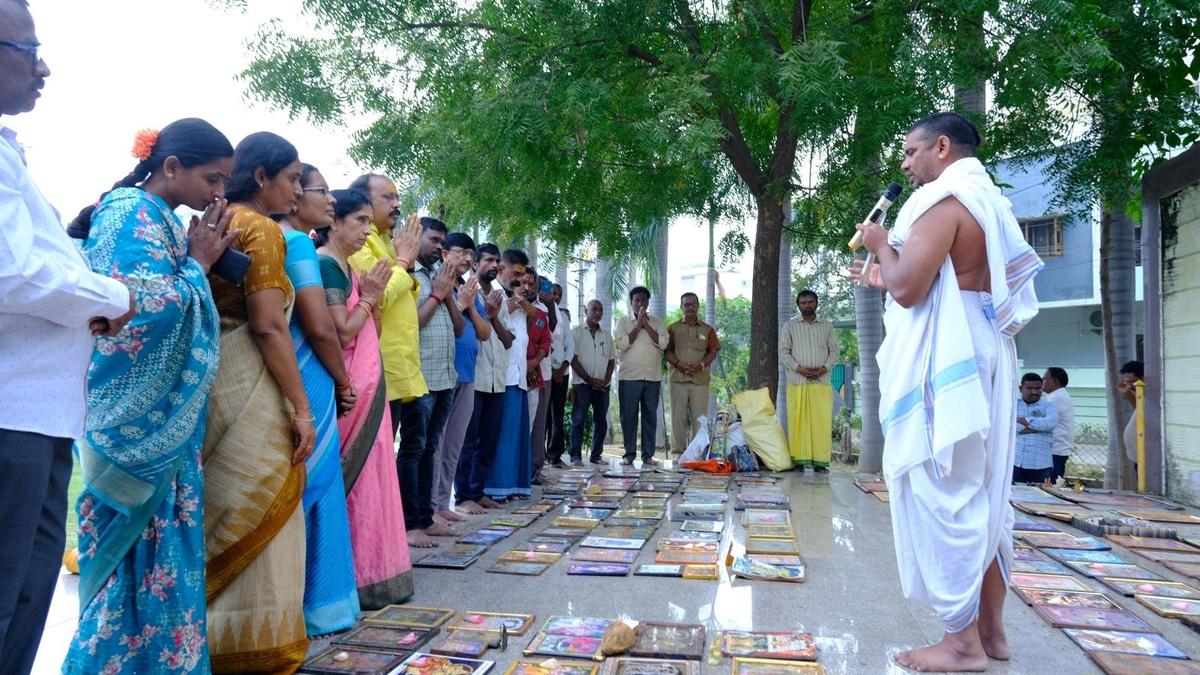 Old photo frames of deities disposed off in traditional manner