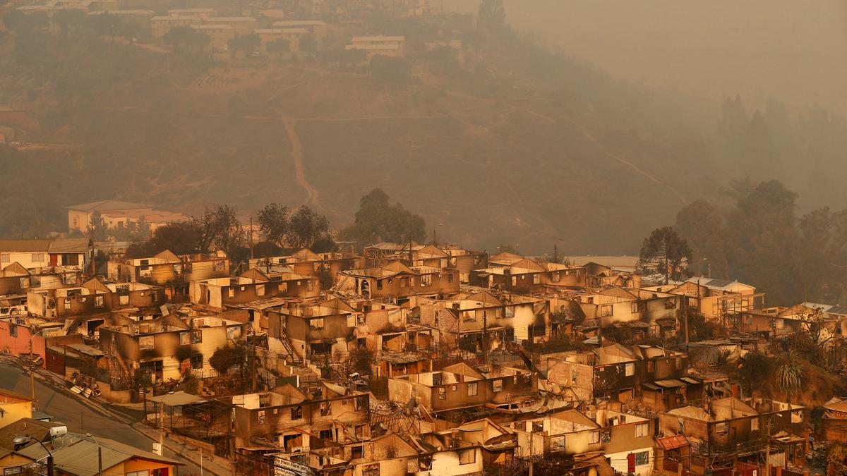 At least 46 reported dead in Chile as forest fires move into densely populated central areas