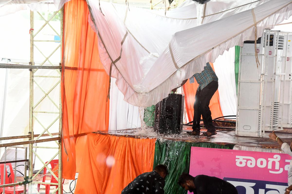 The roof of the pandal was brought down by the rain and strong wind at Congress MP Rahul Gandhi’s public meeting in Jewargi, Kalaburagi district, on April 28, 2023. 