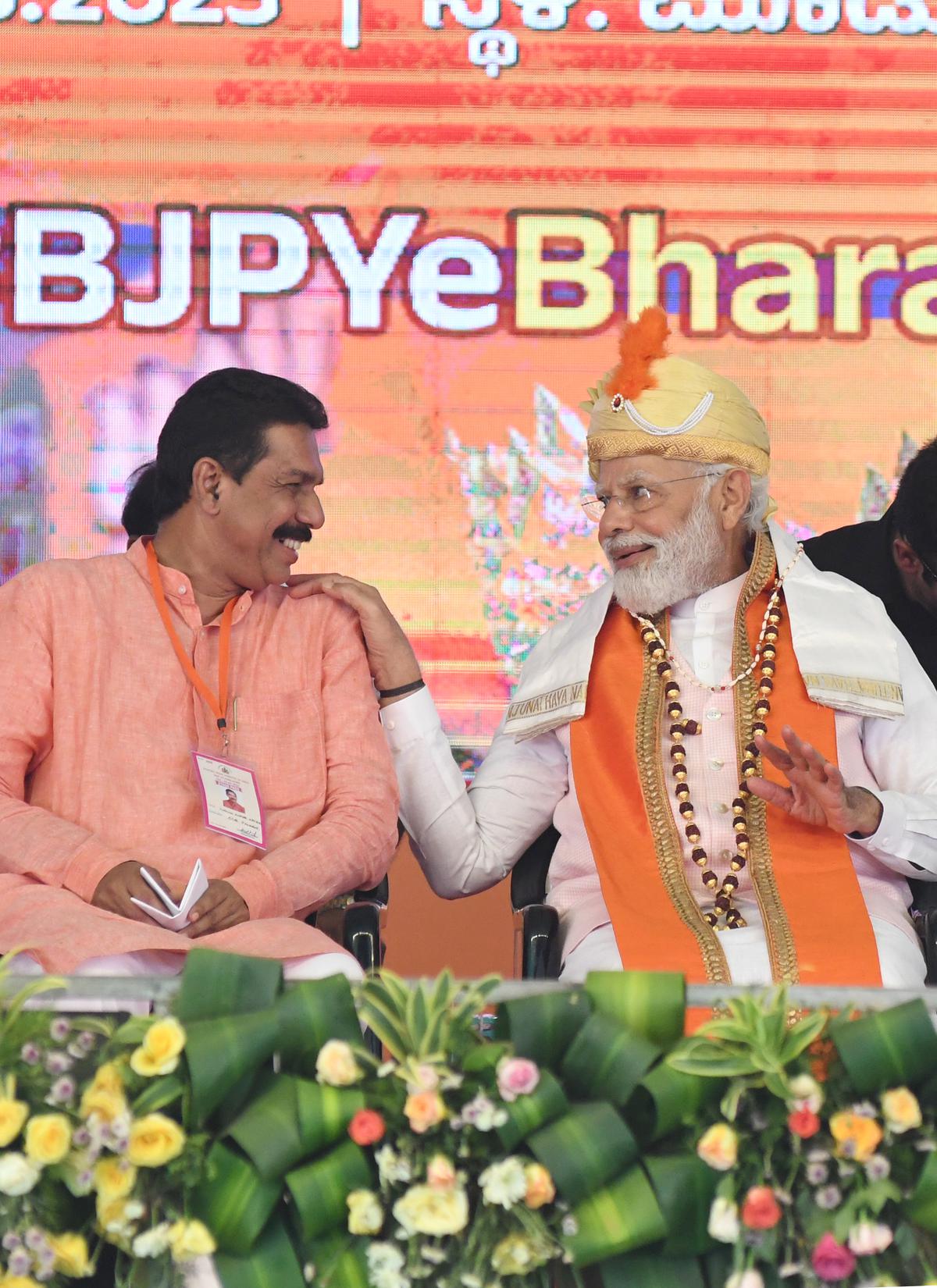 BJP state president Nalin Kumar Kateel and Prime Minister Narendra Modi addressing an election rally in Mulki on Wednesday. 