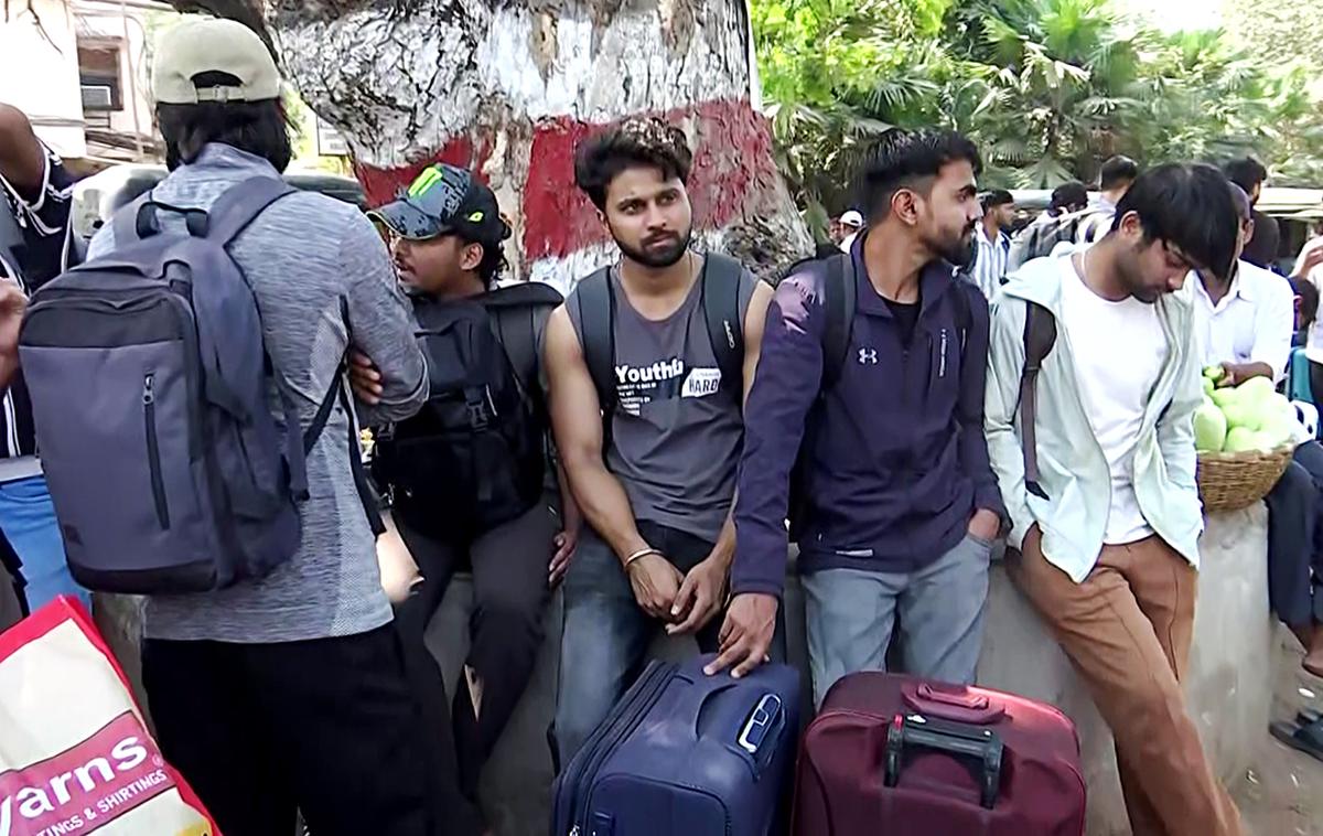 Nepali students leave the Kalinga Institute of Industrial Technology after the administration evicted them. 