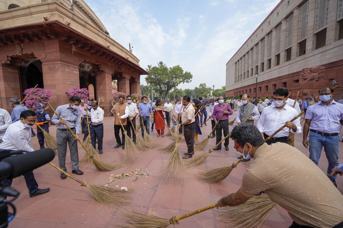 Parliament employees during a cleanliness drive organised under the ‘Swachchta Pakhwada: Swachchta hi Seva’ campaign ahead of Gandhi Jayanti, at Samvidhan Sadan and Parliament House complex, in New Delhi, on October 1, 2023. Parliament employees during a cleanliness drive organised under the ‘Swachchta Pakhwada: Swachchta hi Seva’ campaign ahead of Gandhi Jayanti, at Samvidhan Sadan and Parliament House complex, in New Delhi, on October 1, 2023.