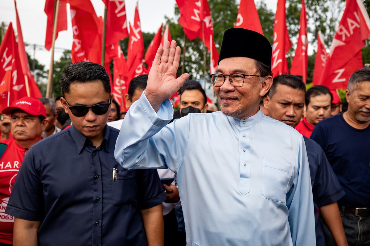 Malaysia’s opposition leader Anwar Ibrahim greets supporters in Tambun, Perak, Malaysia.