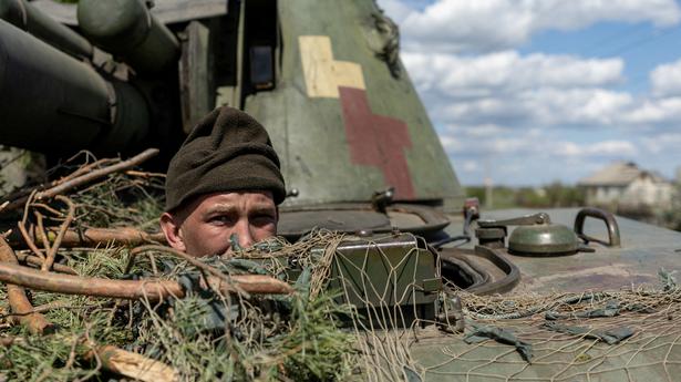 Russian troops 'encircled' near key Ukraine town in annexed region