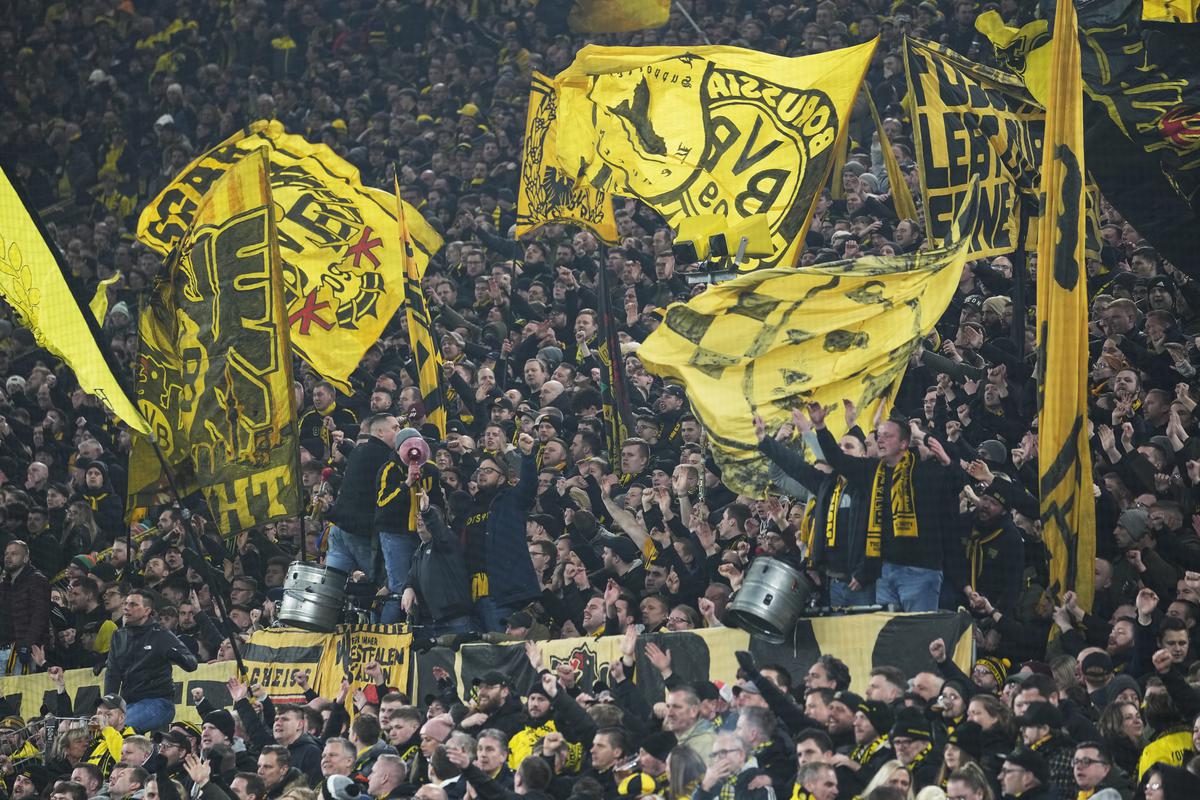 Dortmund’s fans celebrate as their team won the German Bundesliga soccer match between Borussia Dortmund and RB Leipzig in Dortmund, Germany, Friday, March 3, 2023. 