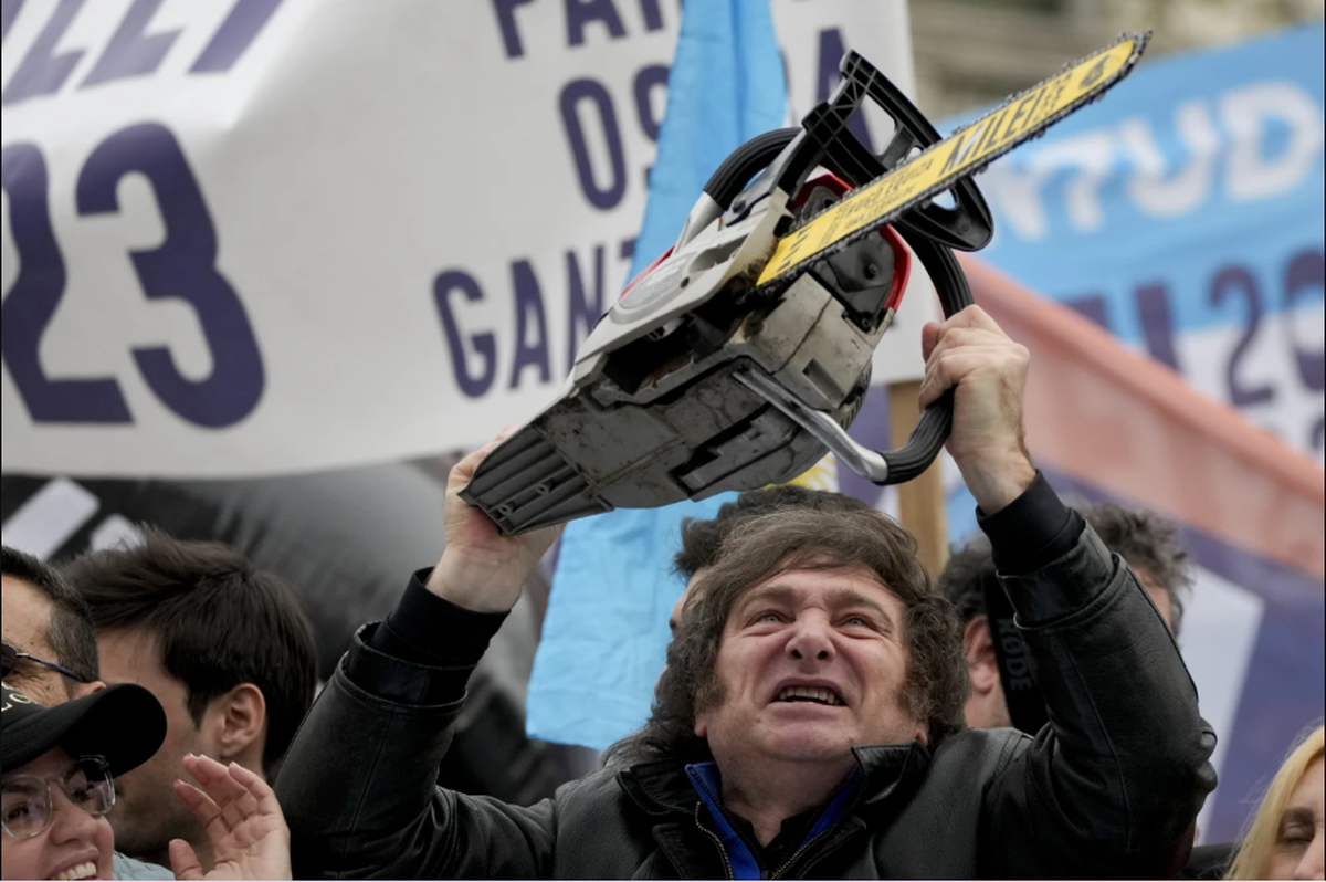 Presidential hopeful Javier Milei brandishes a chainsaw during a campaign event in La Plata, Argentina, on Tuesday, September 12, 2023