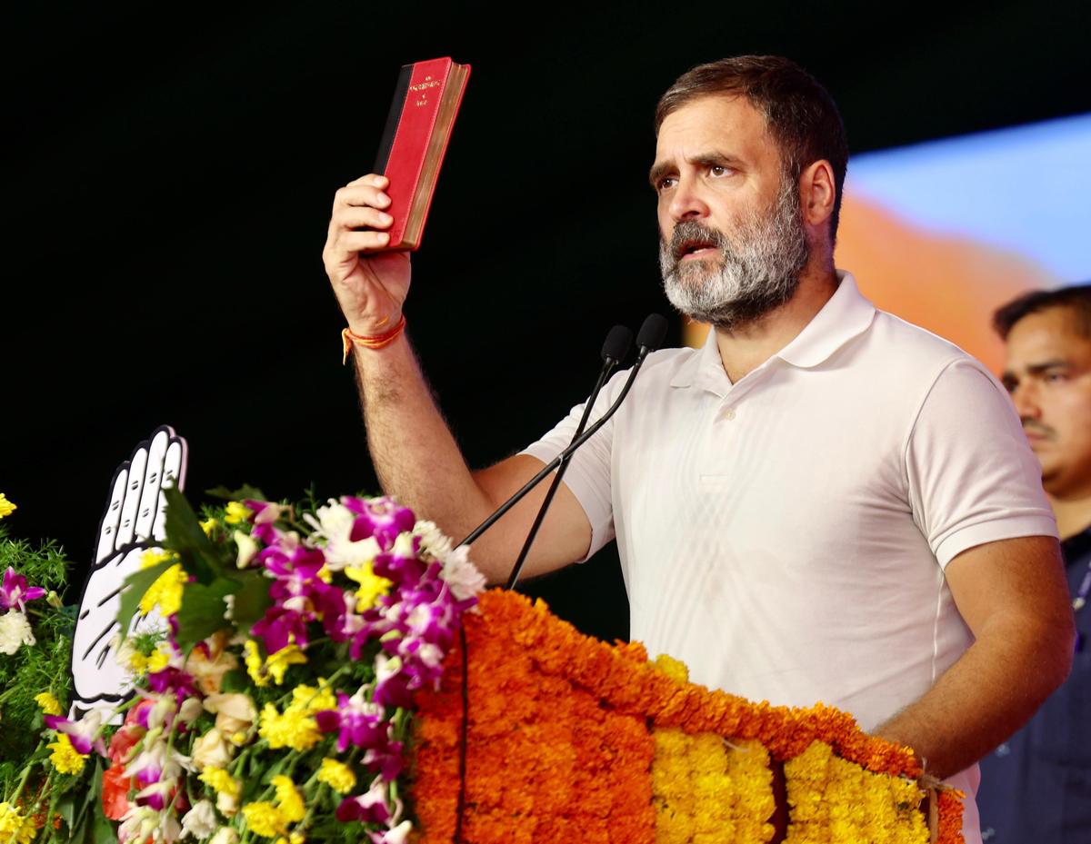 Congress leader Rahul Gandhi displays a copy of the Constitution of India during a public meeting in Nagarkurnool on May 5, 2024. Photo: X/@INCIndia via ANI