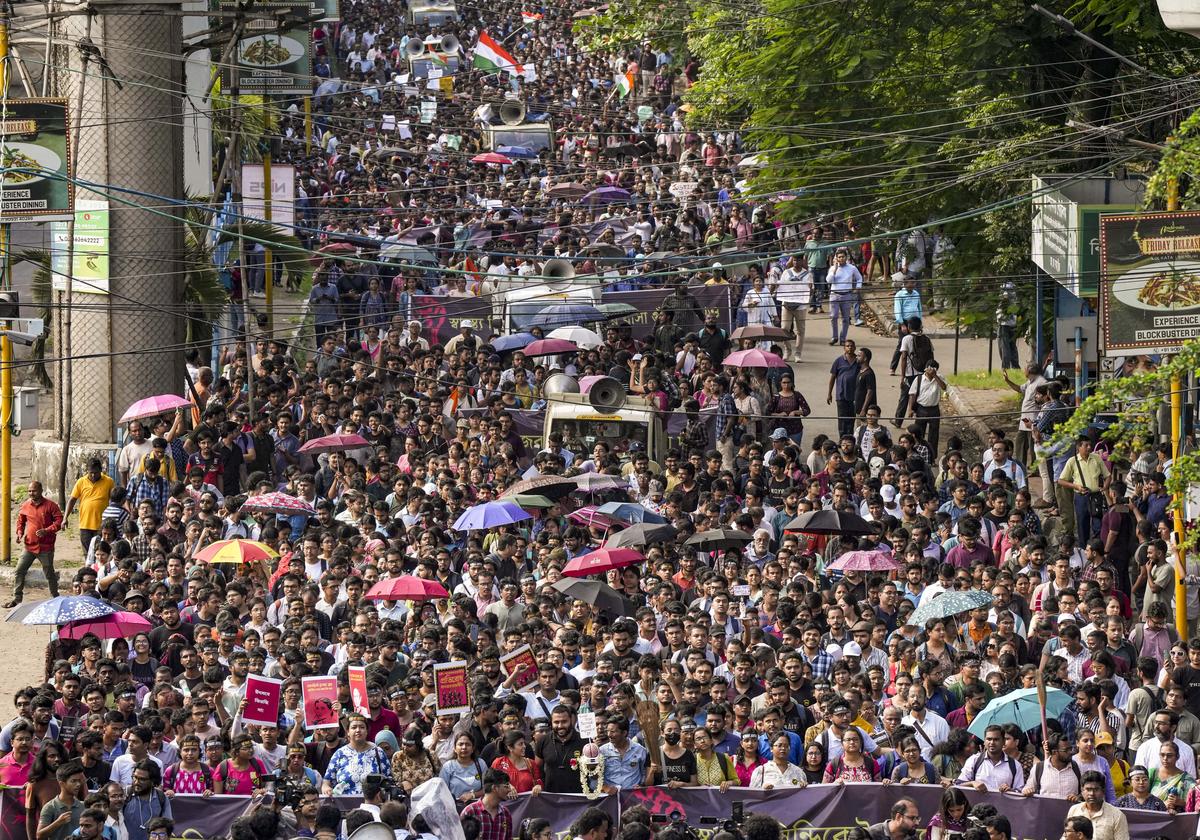 Junior doctors march towards Swasthya Bhawan during a protest over the R.G. Kar Hospital rape and murder incident, in Kolkata. 