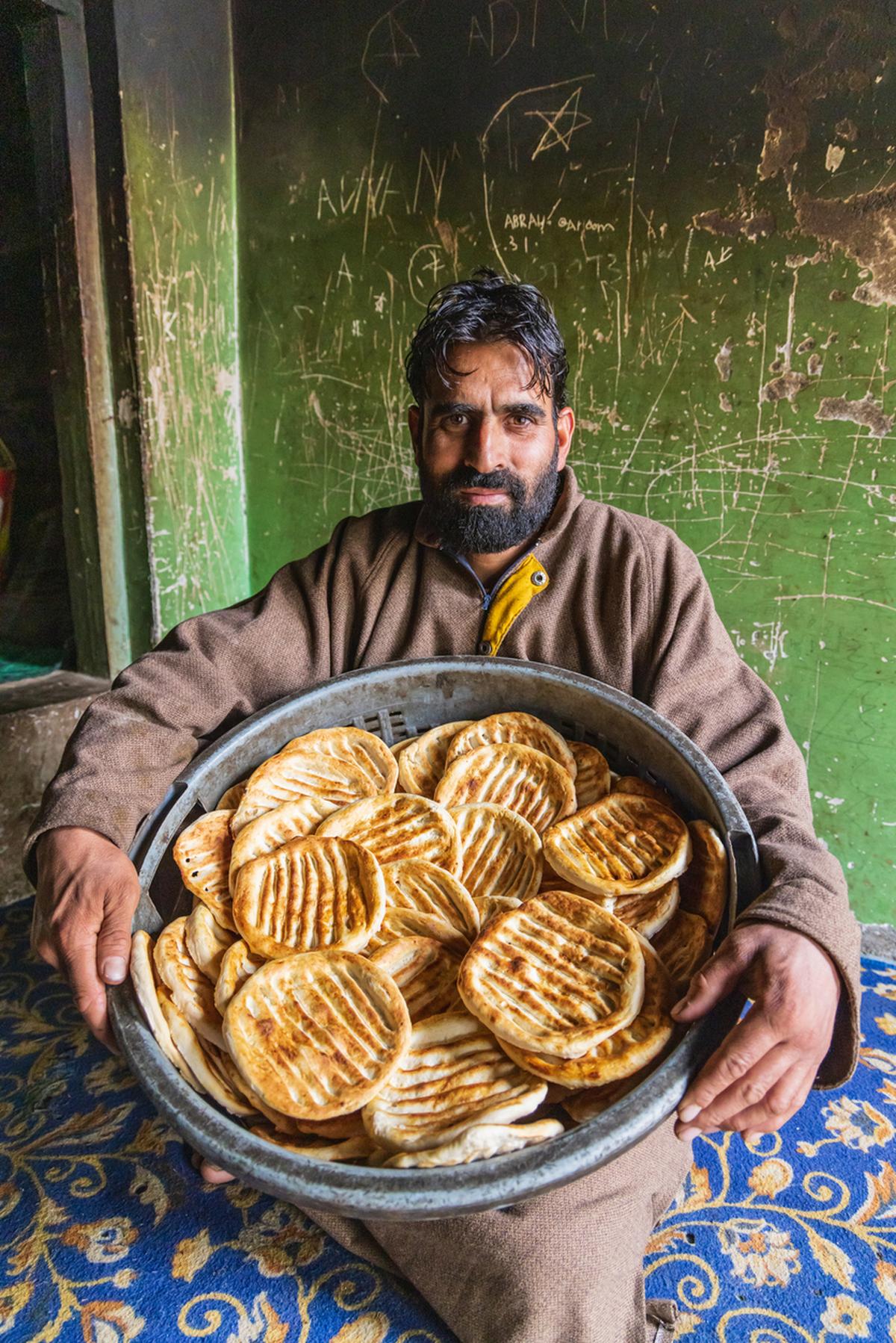 A baker with freshly made flatbread in Kashmir.
