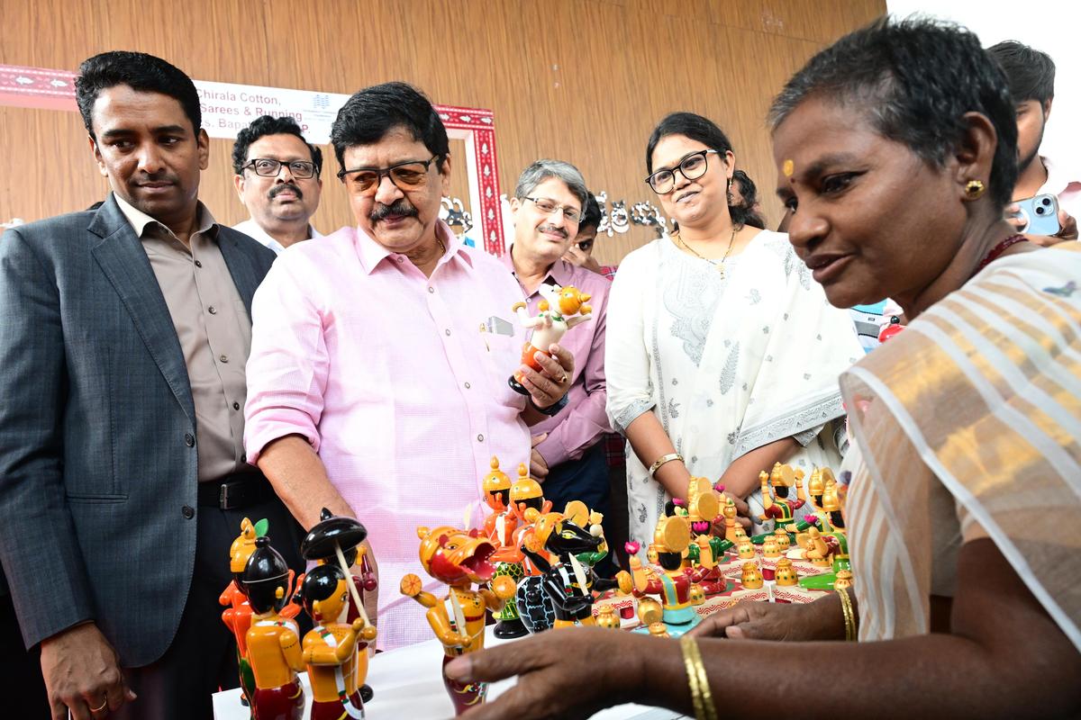 Minister of Tourism and Culture Kandula Durgesh, NTR District Collector S. Laxmisha and Andhra Pradesh Star Hotels Association president R. V. Swamy at a stall during ‘Krishnaveni Sangeetha Neerajanam’ in Vijayawada on Saturday