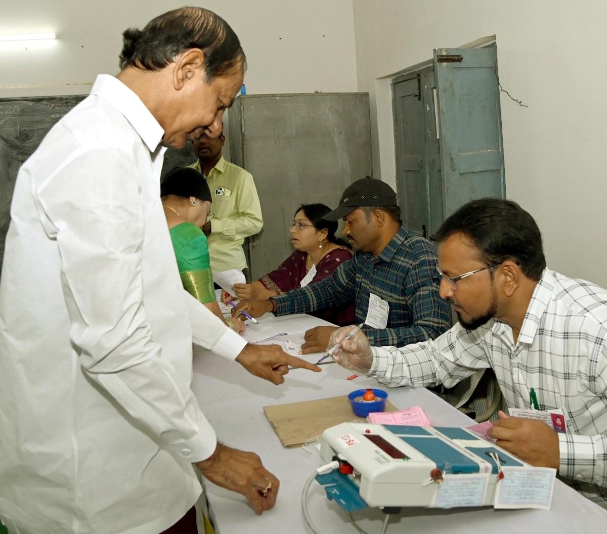 Chief Minister K. Chandrashekhar Rao completing the process before casting his vote in a polling station at Chintamadaka village in Siddipet    district on Thursday. 
