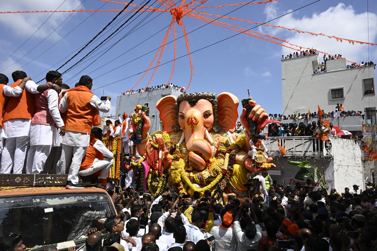 Devotees take part in the procession of Balapur Ganesh in Rangareddy district on Saturday (September 6, 2025)