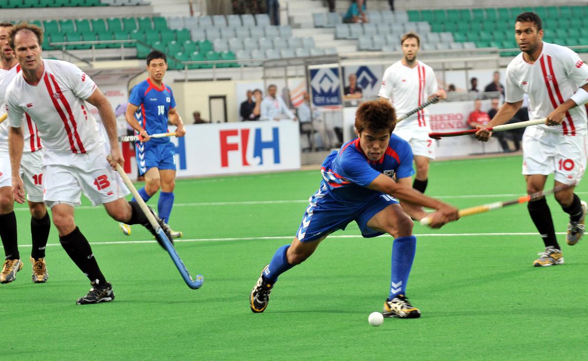 Korea’s You Hyo-Sik scores his second goal against Canada watched during their match in the Hero Honda FIH Hockey World Cup Tournament at  the Major Dhyanchand National Hockey stadium in New Delhi, on March 7, 2010. 