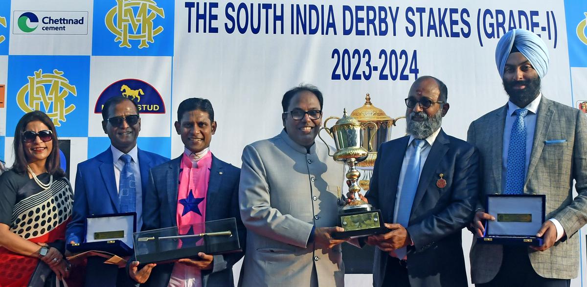 Touch of Grey owner Anil Saraf receiving the South India Derby trophy from MRC chairman M.AM.R. Muthiah in the presence of, from left,  Kavita Saraf, trainer Satish Narredu, jockey Suraj Narredu, and breeder Angad Singh at the Madras Race Club, Guindy, in Chennai on Monday (January 15). 