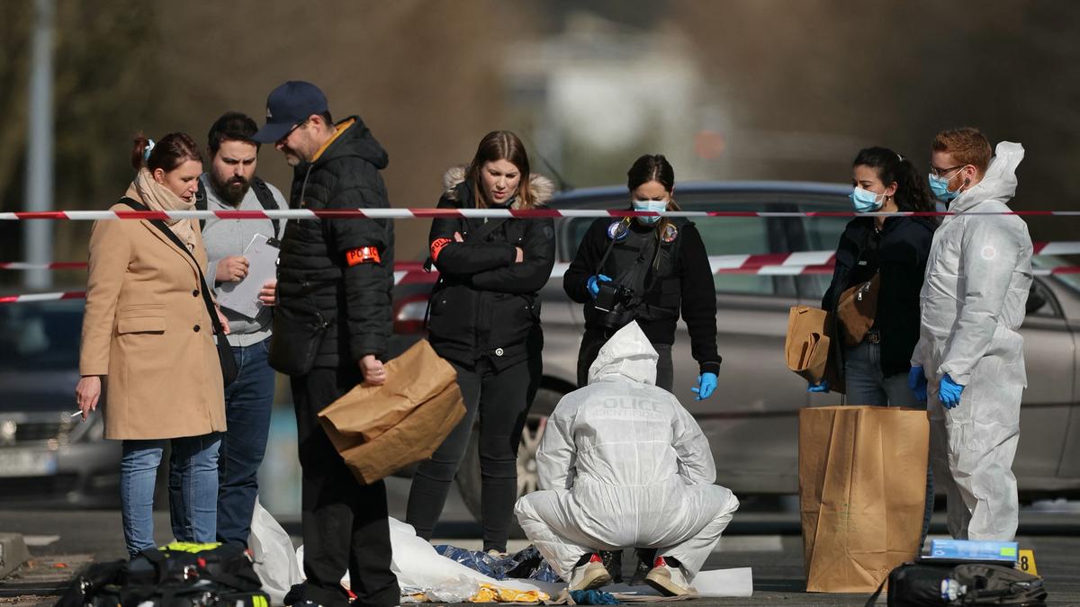 French police say killed man holding knives in Paris region