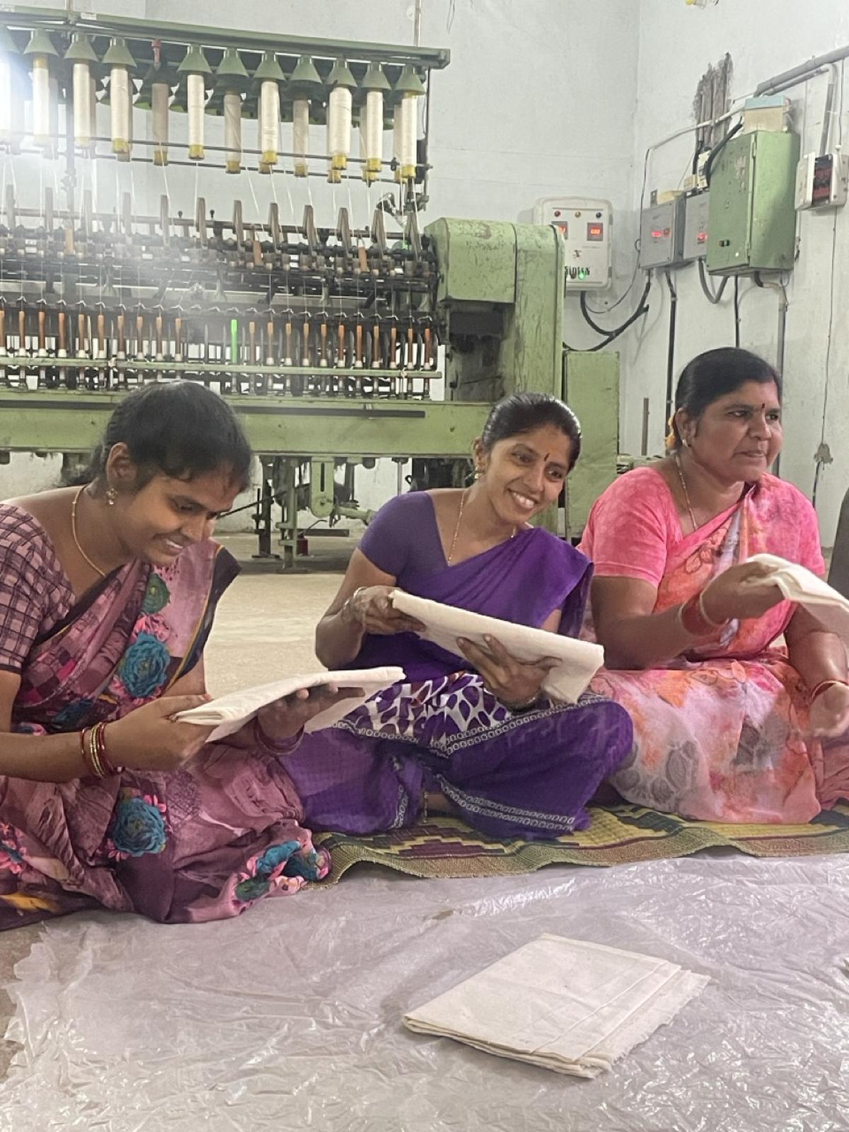 Women at a spinning unit