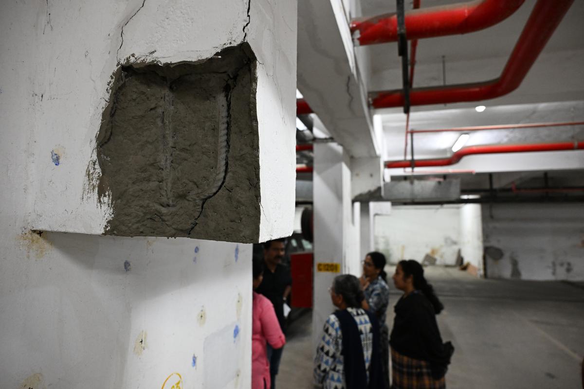 Walls, stripped of concrete, sport rusted reinforcing bars at the twin towers of Chander Kunj Army Towers at Vyttila, Kochi. 