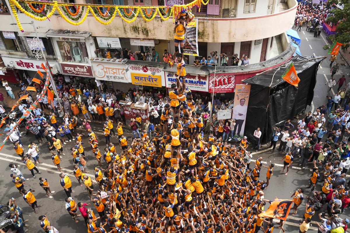 Devotees form a human pyramid to break the ‘dahi handi’, an earthen pot filled with curd, as part of ‘Janmashtami’ festival celebrations, at Dadar in Mumbai, Tuesday, Aug. 27, 2024. Devotees form a human pyramid to break the ‘dahi handi’, an earthen pot filled with curd, as part of ‘Janmashtami’ festival celebrations, at Dadar in Mumbai, Tuesday, Aug. 27, 2024.