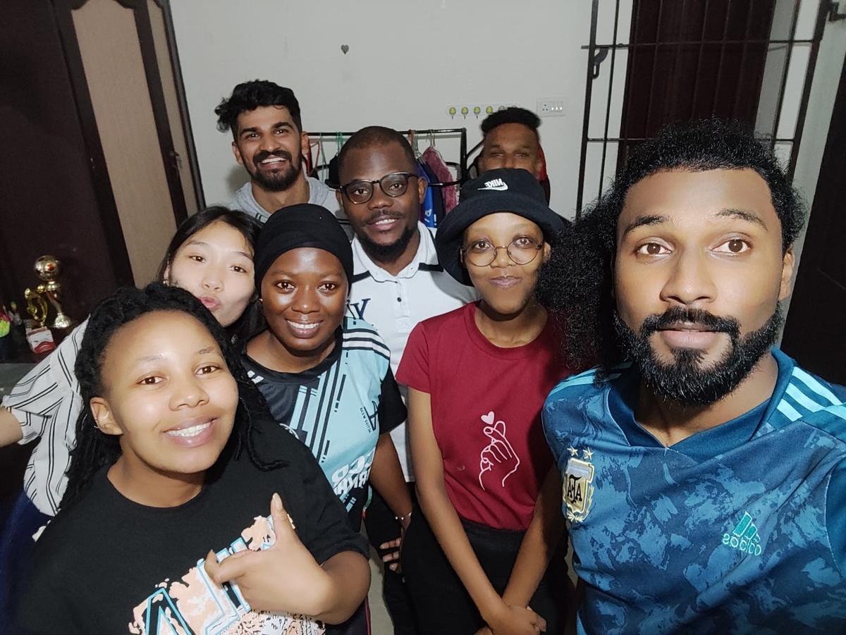 Shad Gobinsingh (right) with foreign students from Lesotho, Botswana, Benin, Vietnam, Gambia and two Indian students during a Christmas celebration