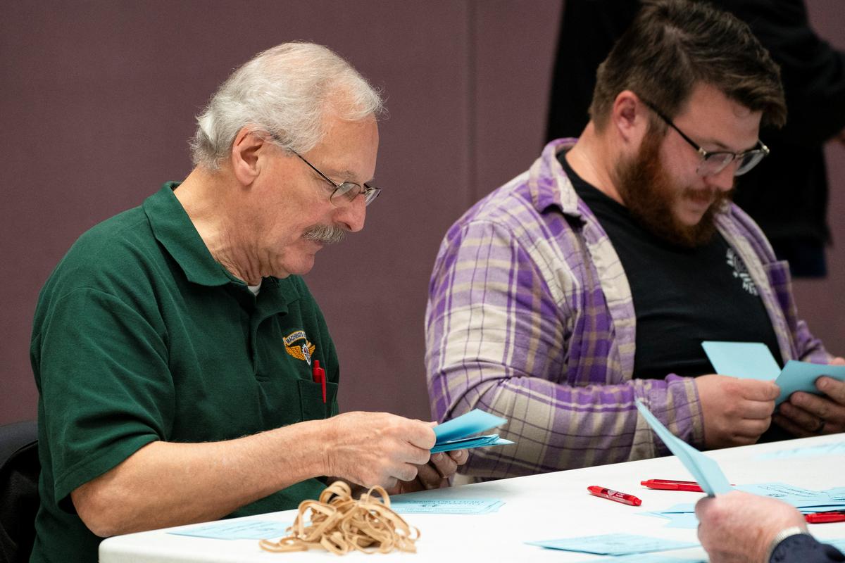 Union members from the International Association of Machinists and Aerospace Workers District 751 count ballots after a vote on a new contract proposal from Boeing at a union hall during an ongoing strike in Seattle, Washington, U.S. on November 4, 2024.