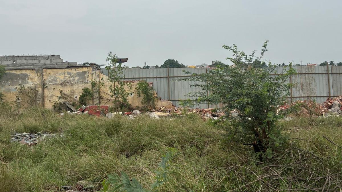 Tin sheets erected to cover damaged wall of Coimbatore airport