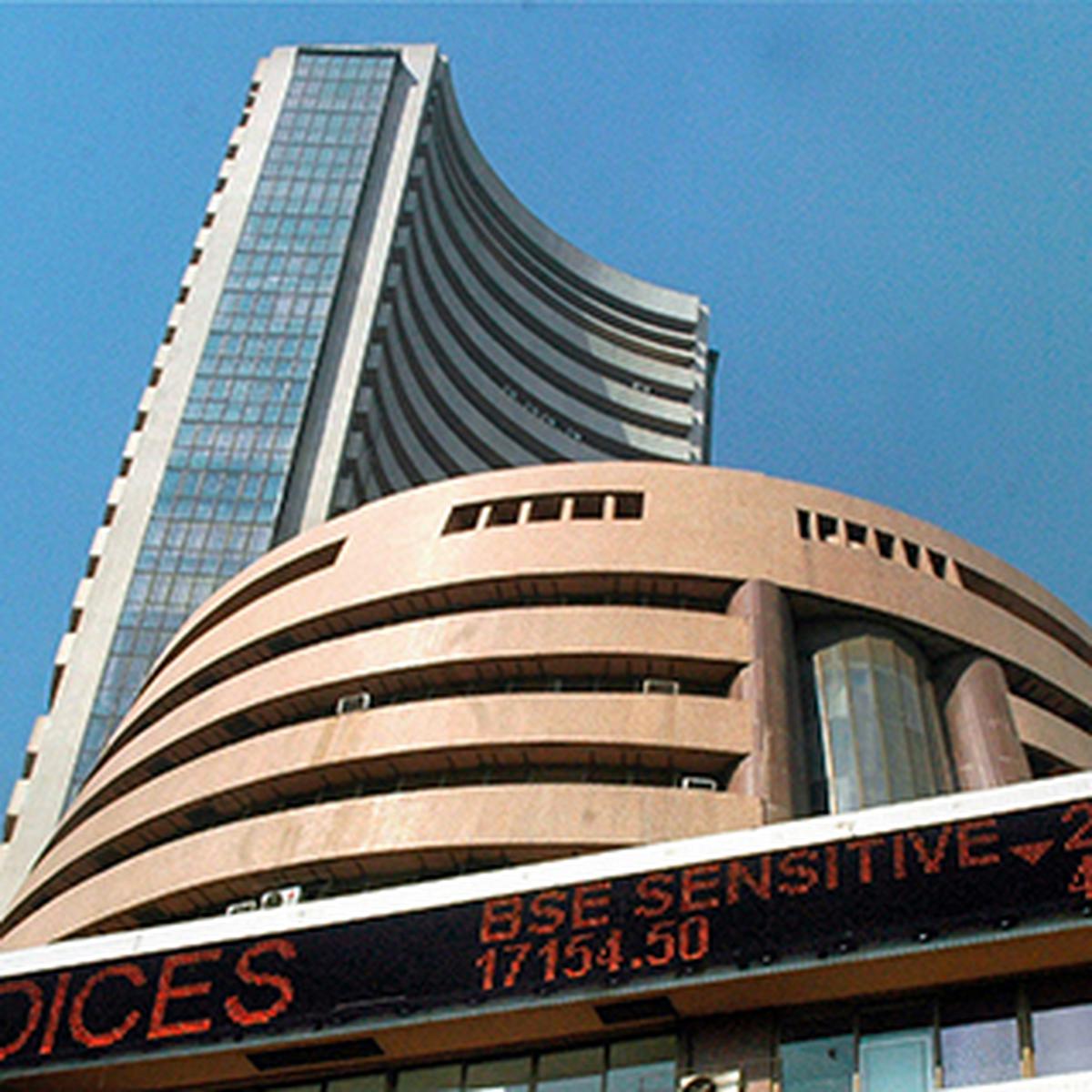 Sensex falls 215 points in volatile trade post RBI rate hike