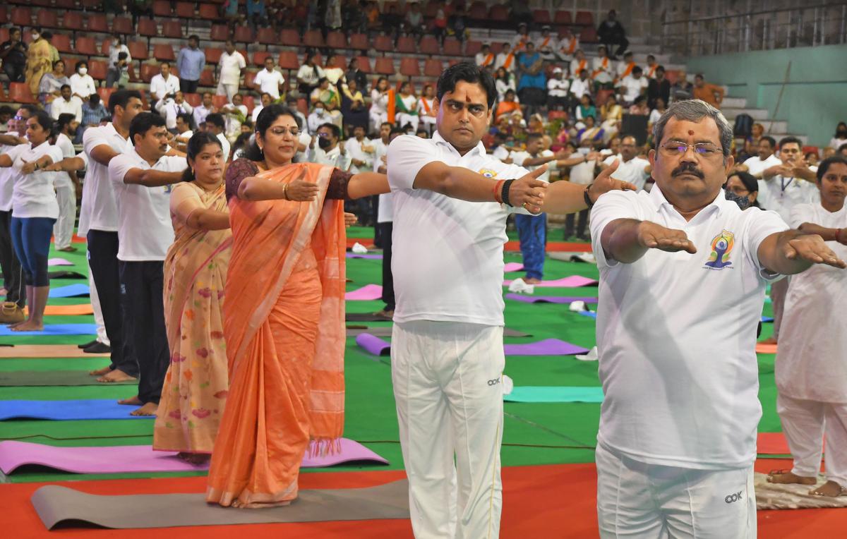 Minister of State for ports, shipping and waterways Shantanu Thakur (second from right) participating in a programme at Swarna Bharathi Indoor Stadium on International Day of Yoga in Visakhapatnam on Tuesday, June 21, 2022.
