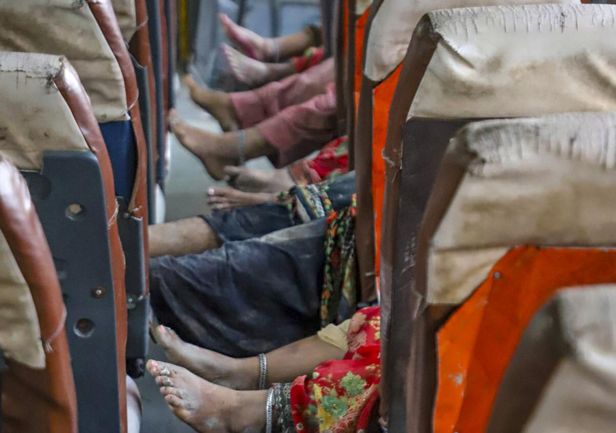 The bodies of victims lie in a bus in Hathras. 